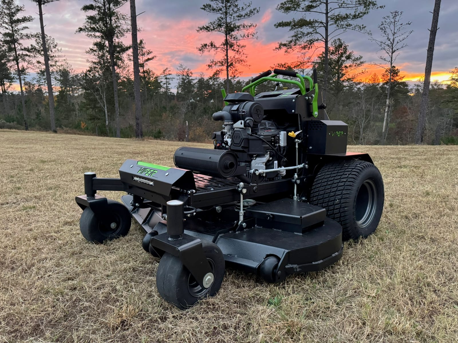 Viper stand-on mower three-quarter at sunset, engine and deck visible